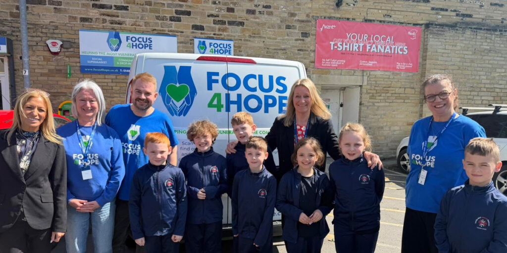 Primary pupils and teachers volunteering at Focus4Hope charity